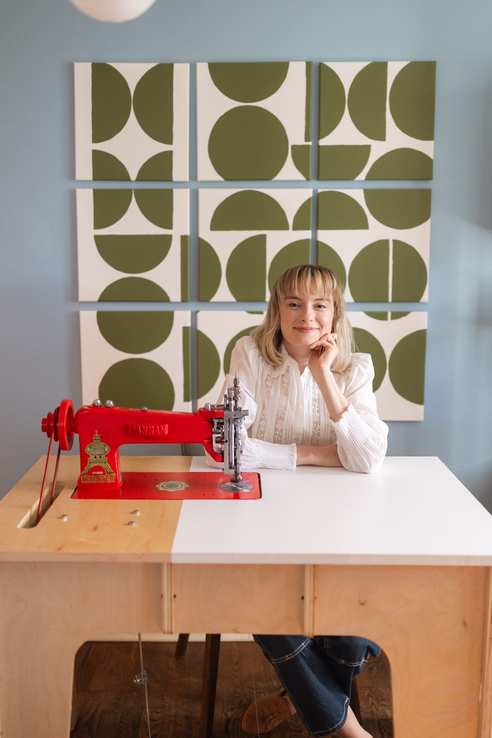 Chloe at her chainstitch machine